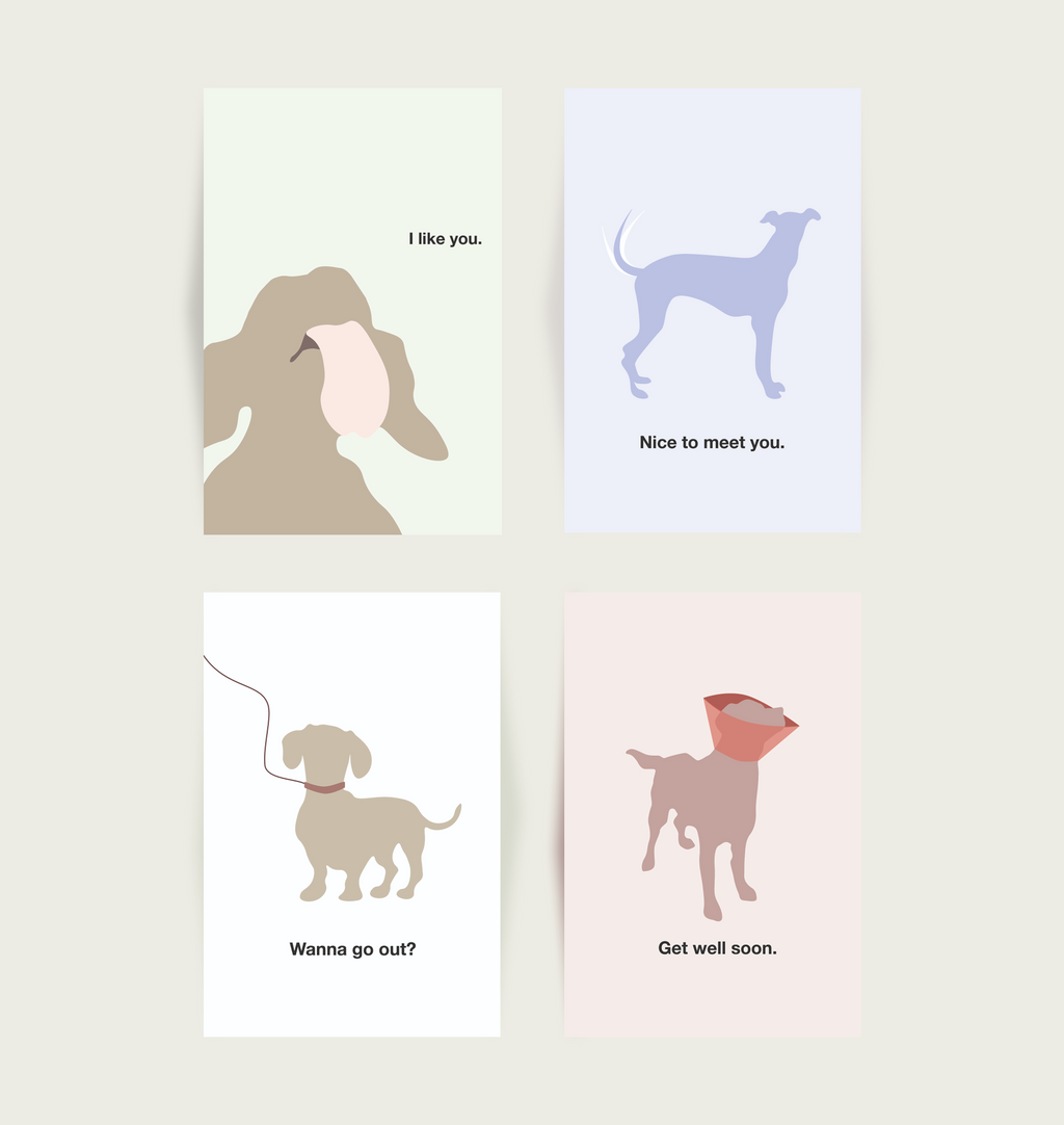 Four greeting cards with dog illustrations and text on a light background