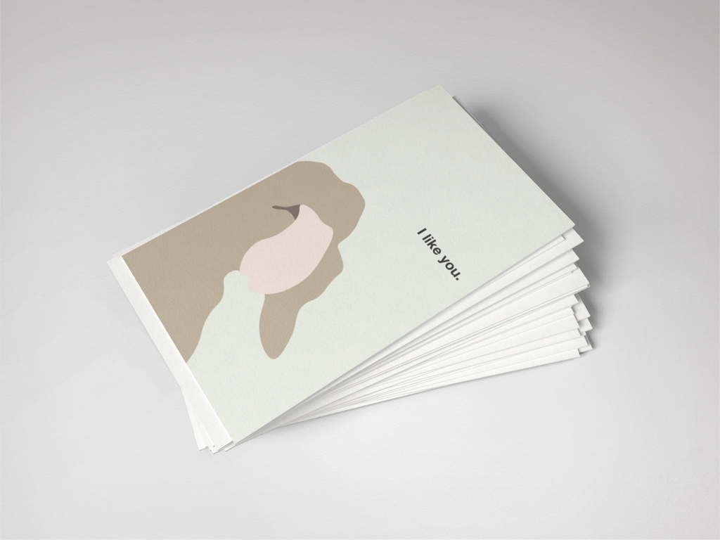 Stack of greeting cards with a minimalist design on a light gray background