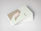 Stack of greeting cards with a minimalist design on a light gray background