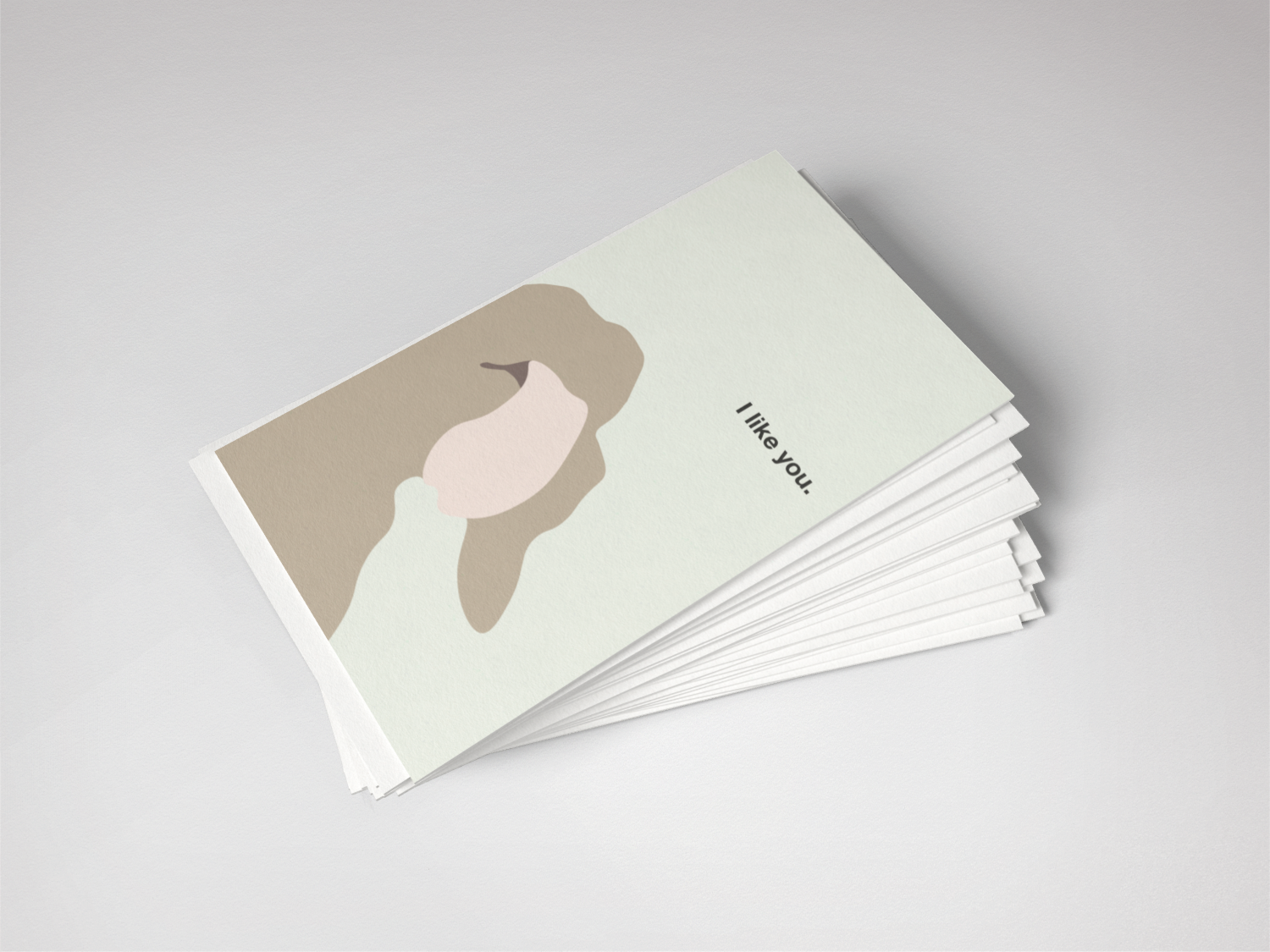 Stack of greeting cards with a minimalist design on a light gray background